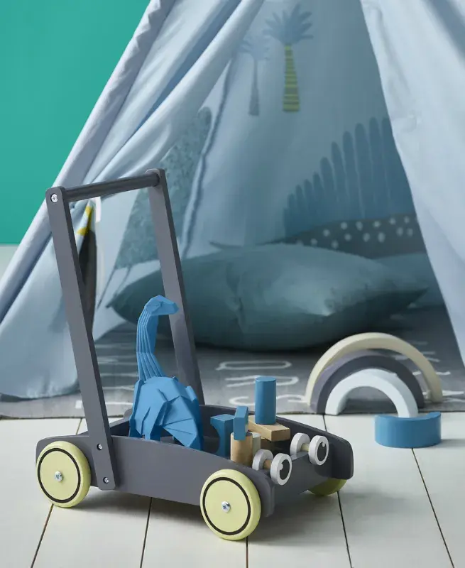 interior playroom toys, tent in background.