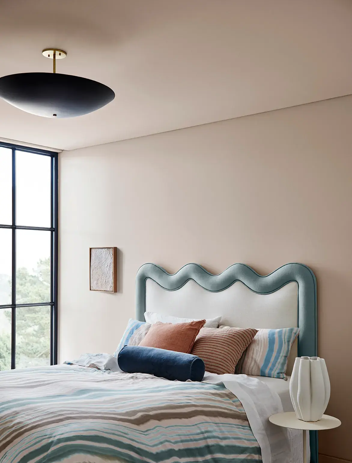 White airy study nook with orange chair