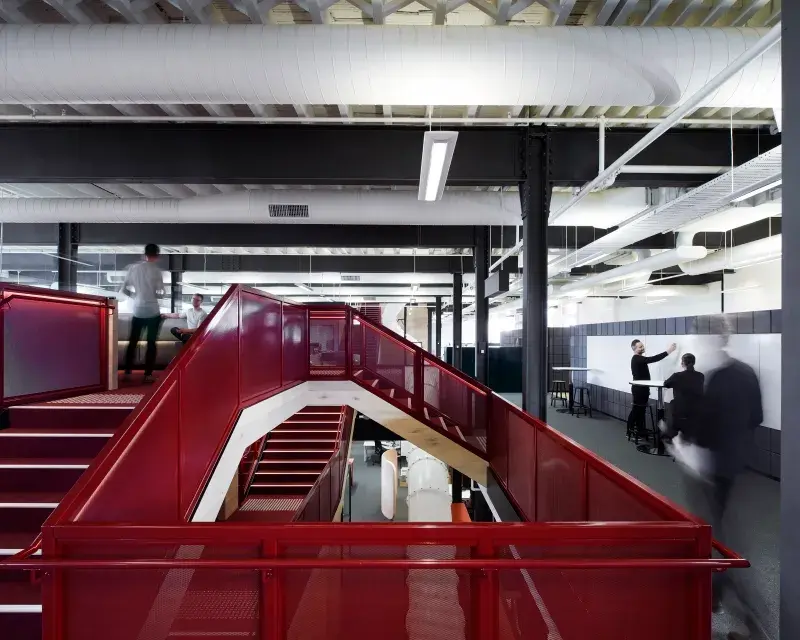 Interior office with red metal railing