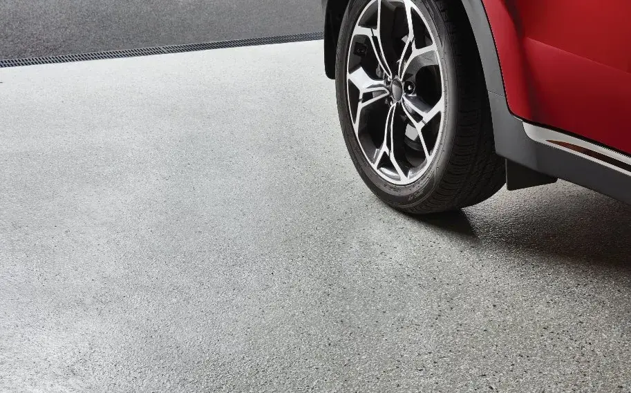 Car parked on a driveway finished with decorative concrete