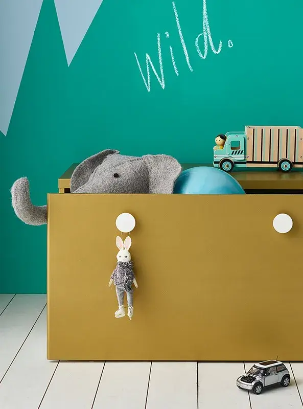 interior playroom close up of yellow toy box.