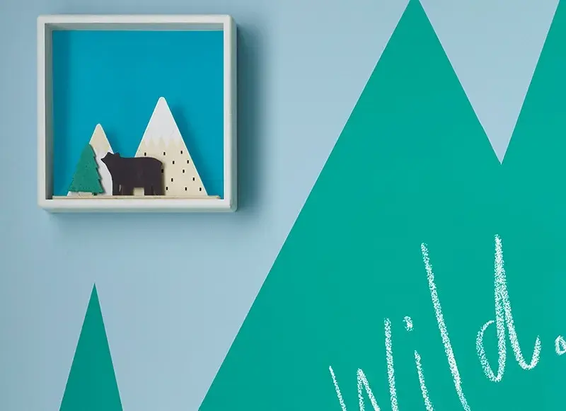 interior close up of playroom wall with shelf.