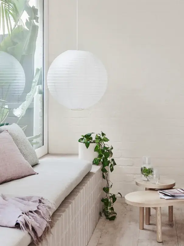bench seat next to window the paper lantern pendant light