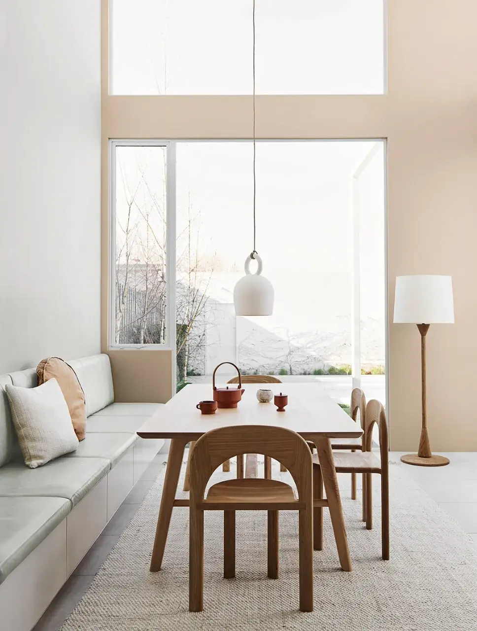 Minimalist interior dining room with soft grey and beige walls