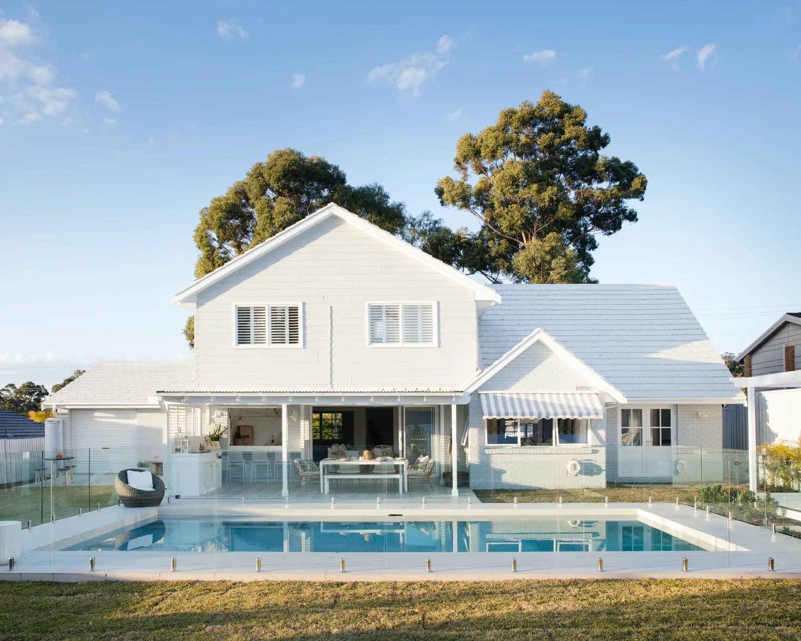Exterior pool for colour me hamptons home by Three Birds Renovations.