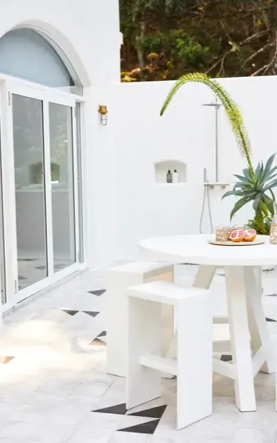 White outdoor shower and patio