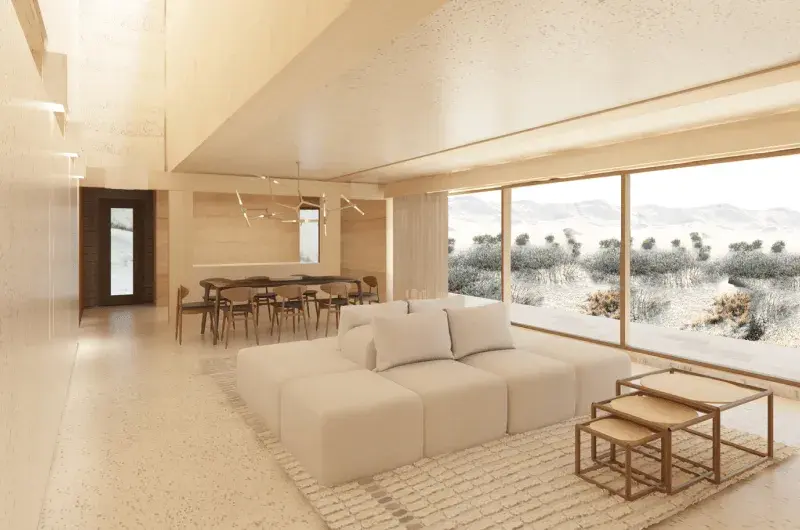Cream colour room with large window, cream couch, nested side tables and dining table and chairs