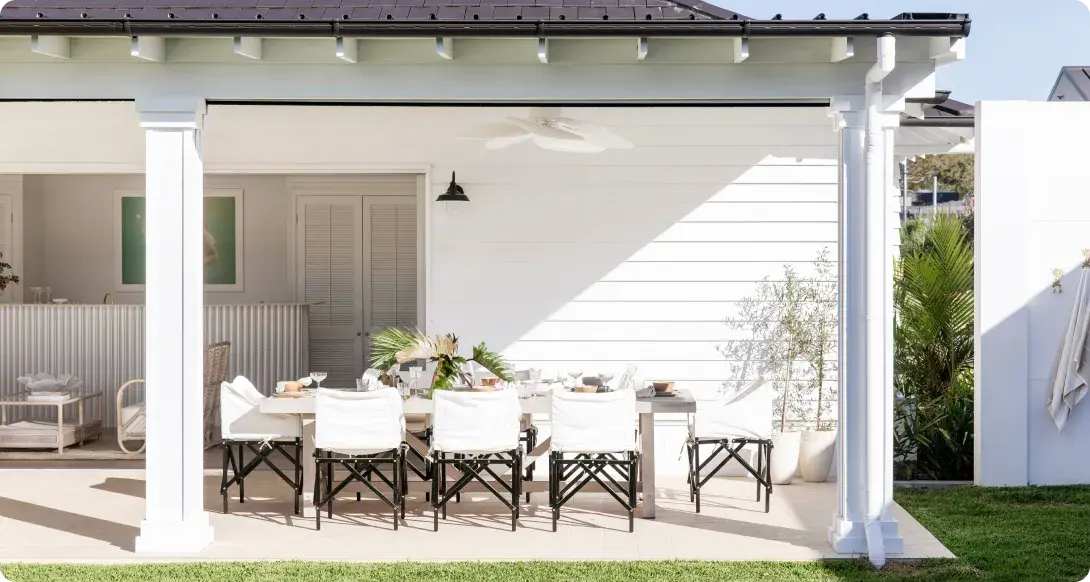 White house with outdoor patio entertaining area