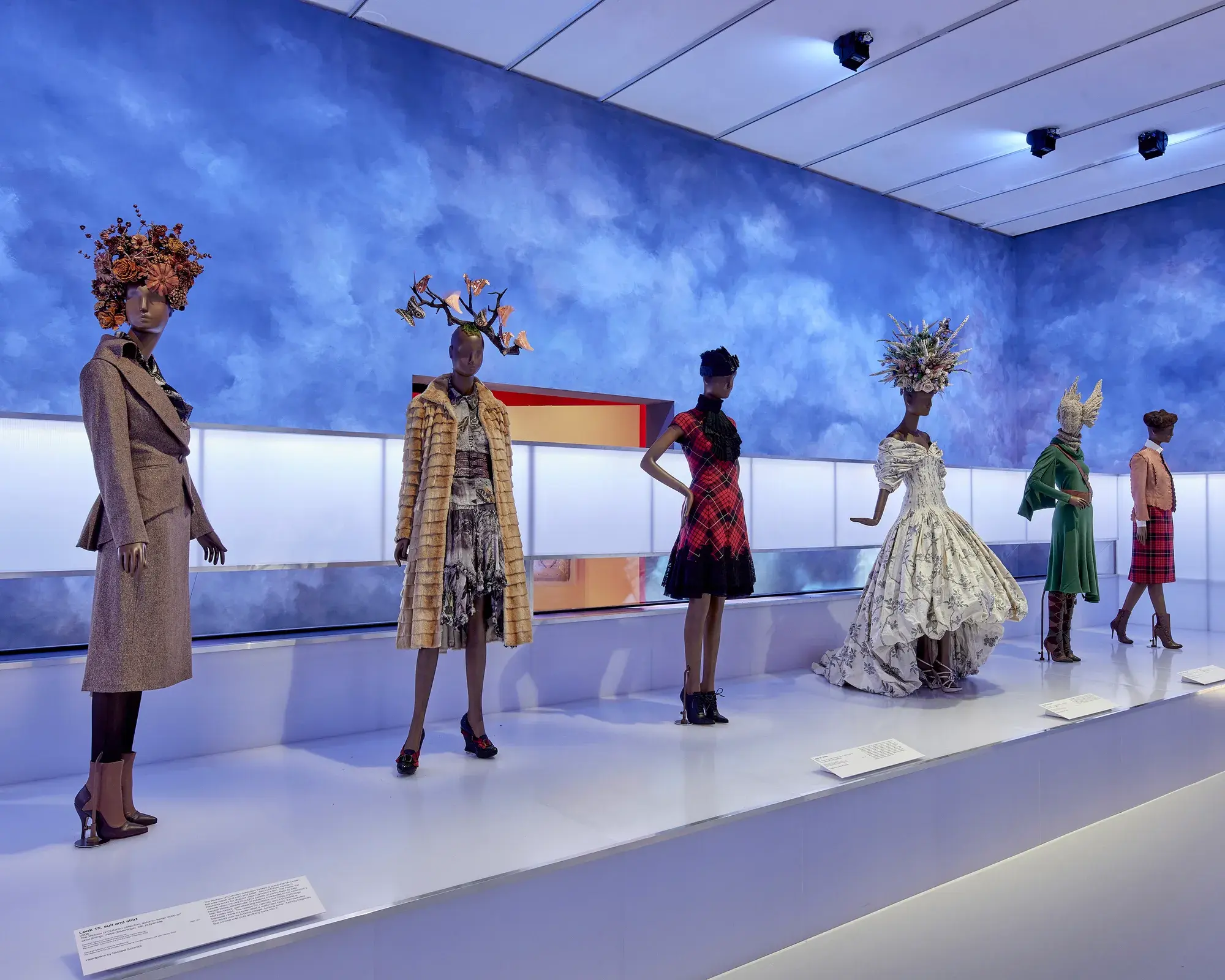 Alexander McQueen Installation at the National Gallery of Victoria with blue, cloudy background