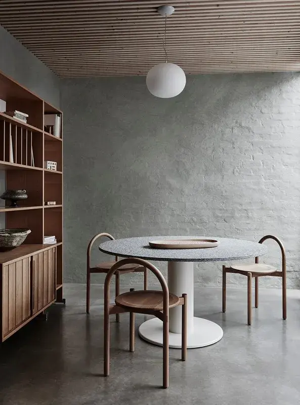 interior grey dining room with table and chairs.