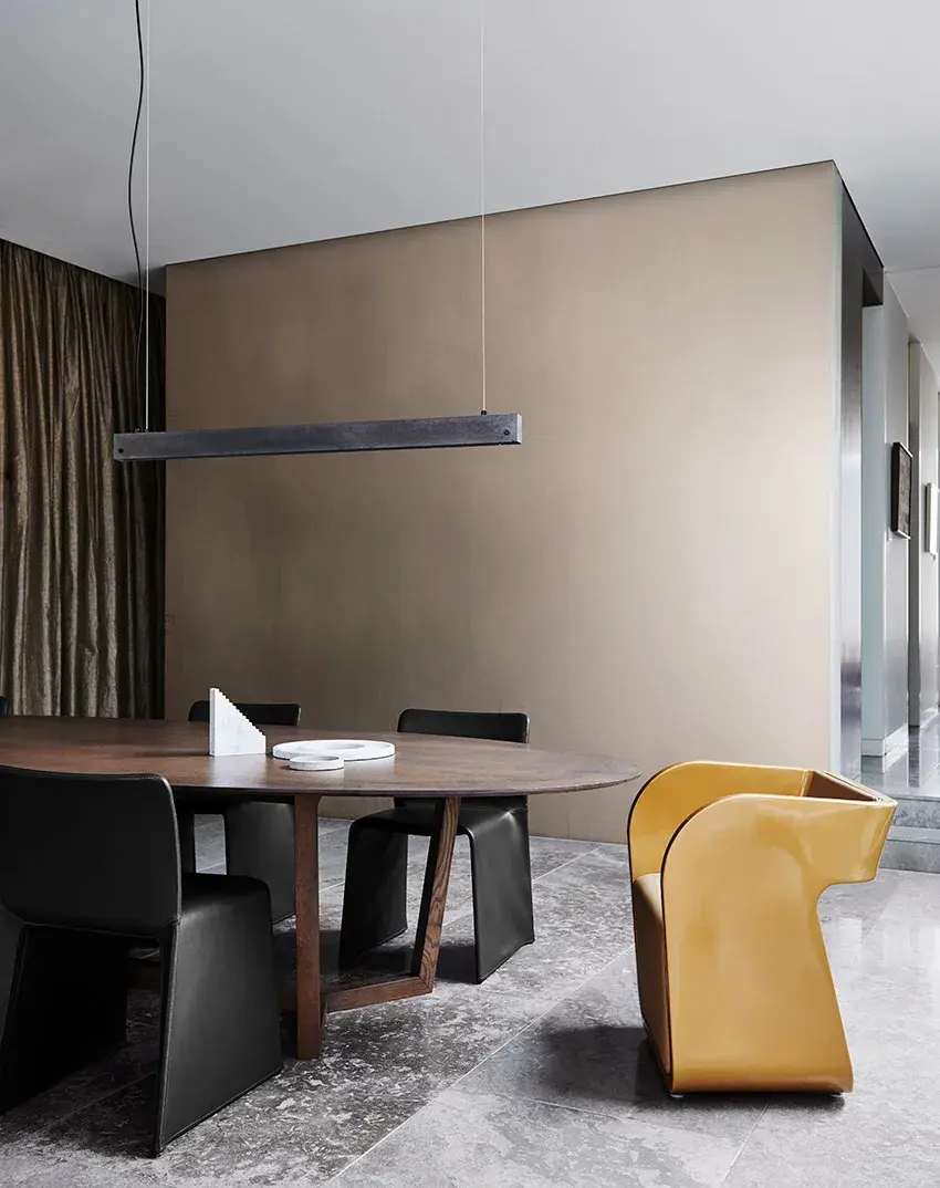 interior dining black chairs with one brown.