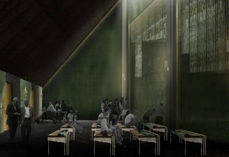 People sitting on benches in a dark room.