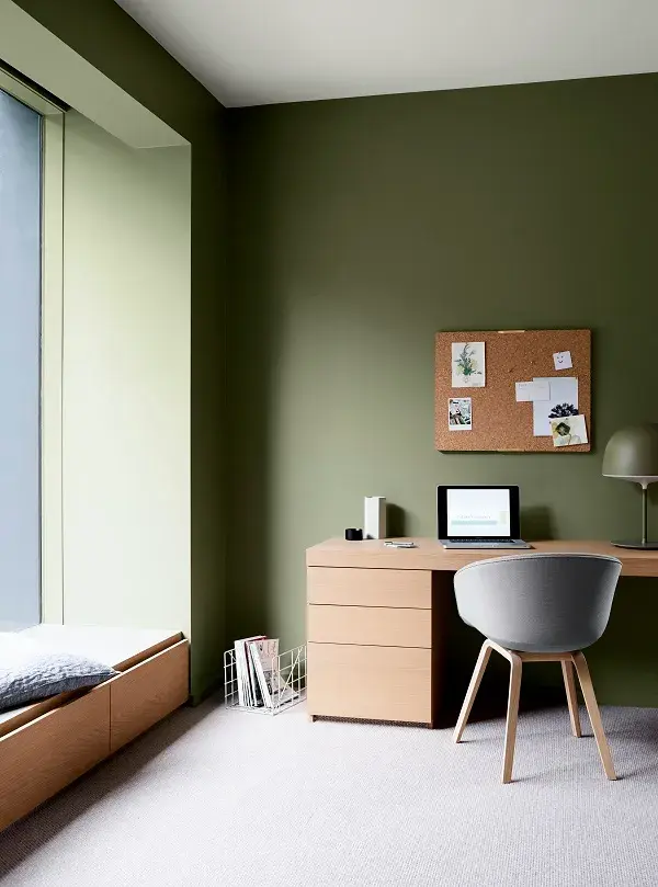 Green study with modern timber desk and large window