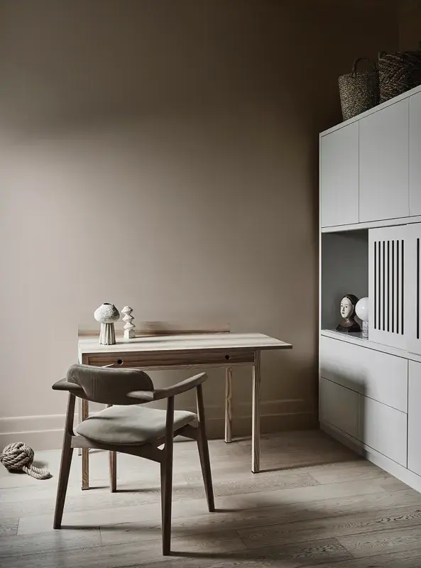 Study space with desk and brown wall with white shelf 