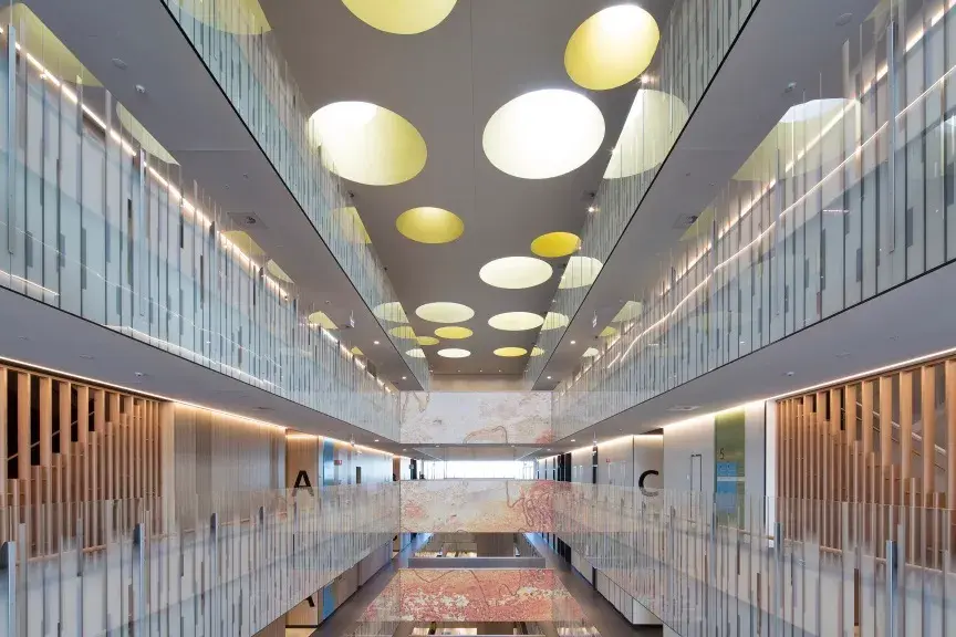 interior hallway with circular ceiling lights.