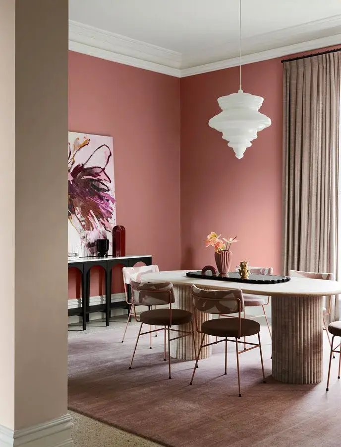 Pink interior dining room with white pendant light