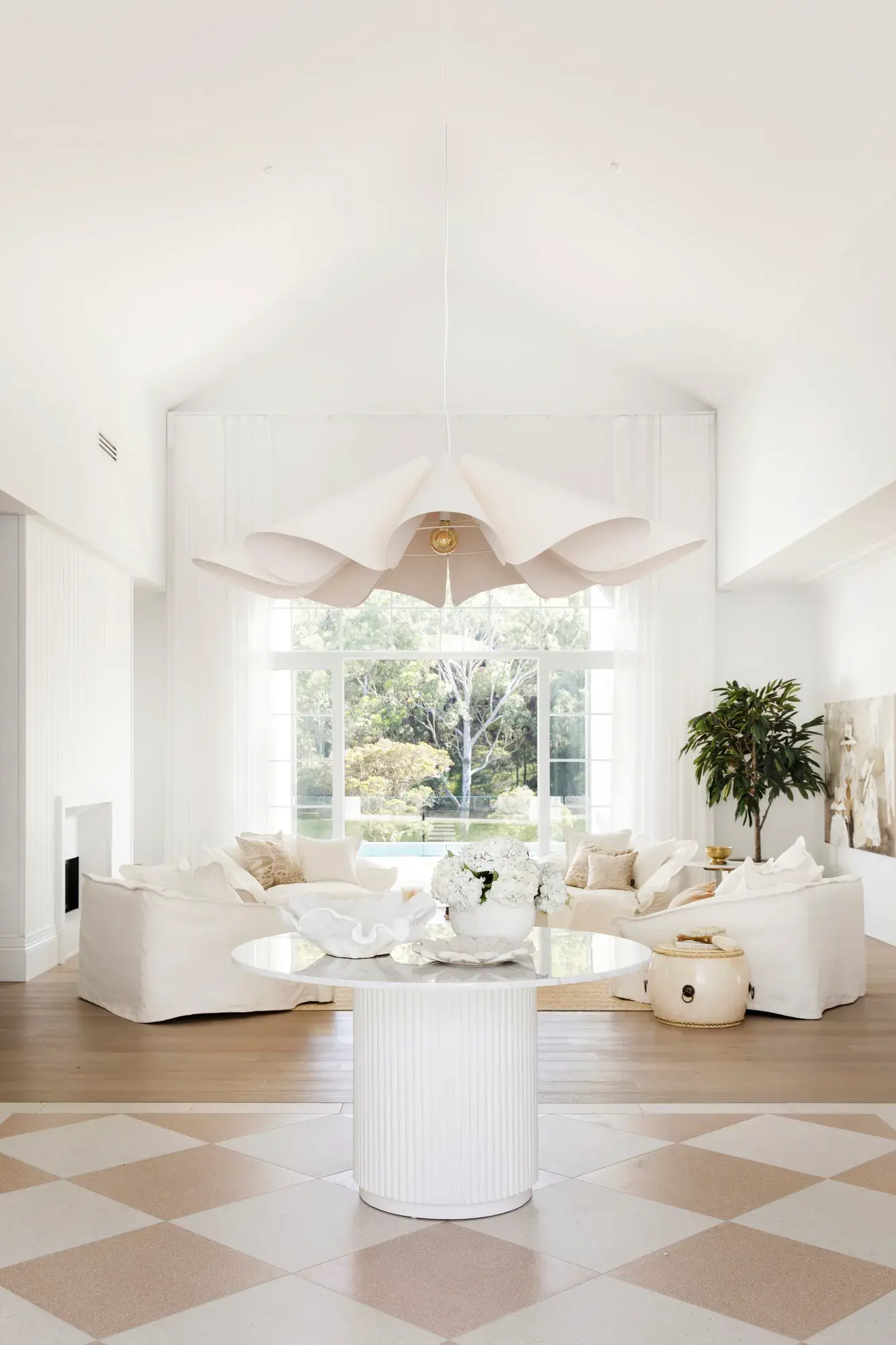 White interior grand entrance by Three Birds Renovations