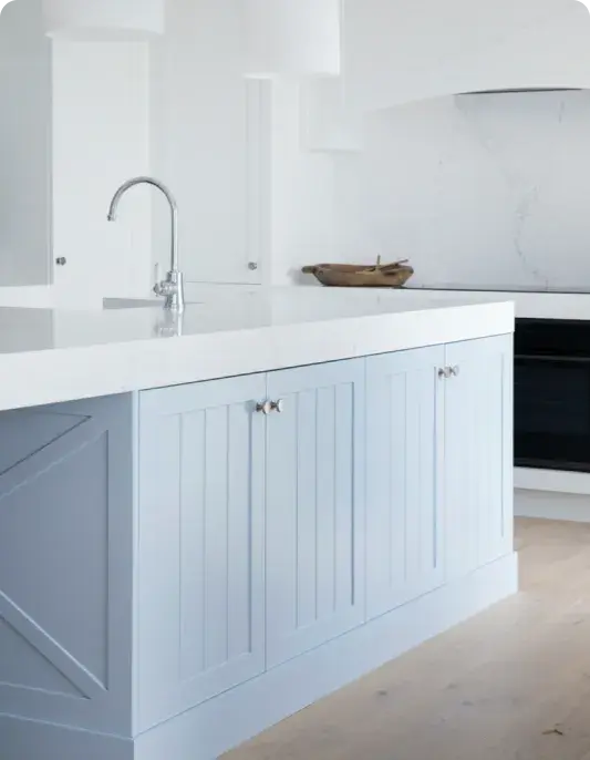 White kitchen with blue cabinets