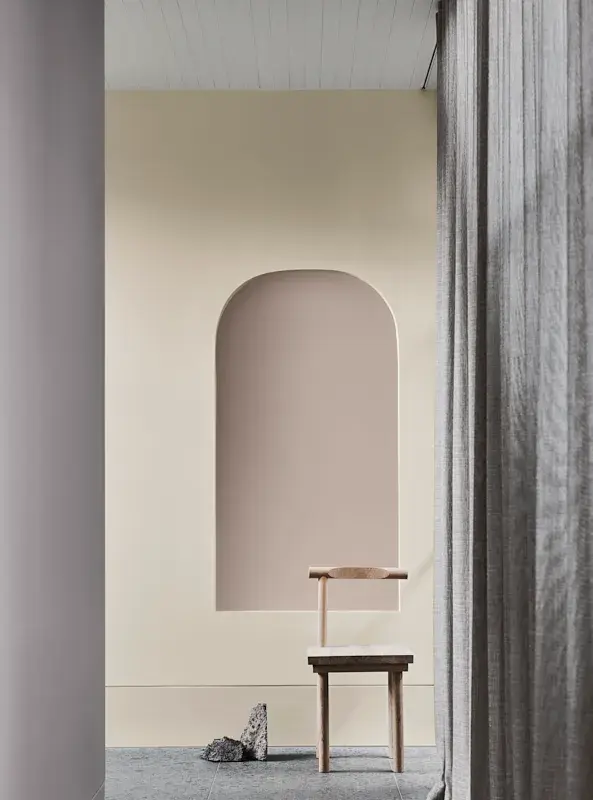Neutral hallway with wooden chair