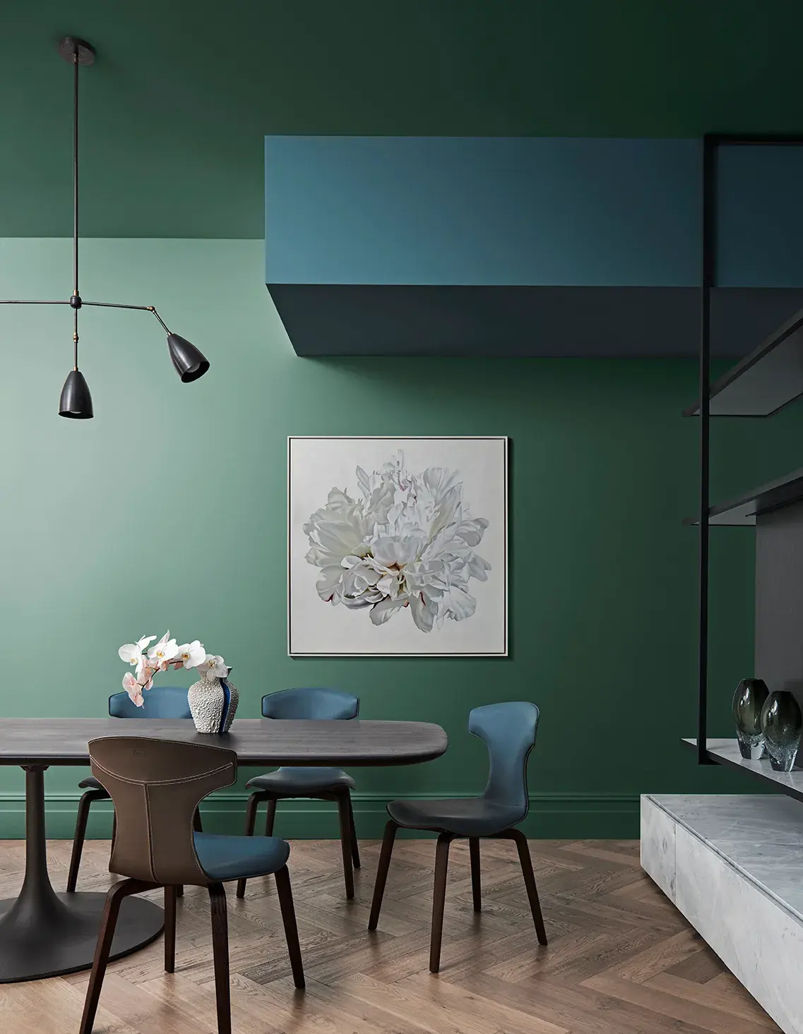 Dining room with green walls and blue bulkhead