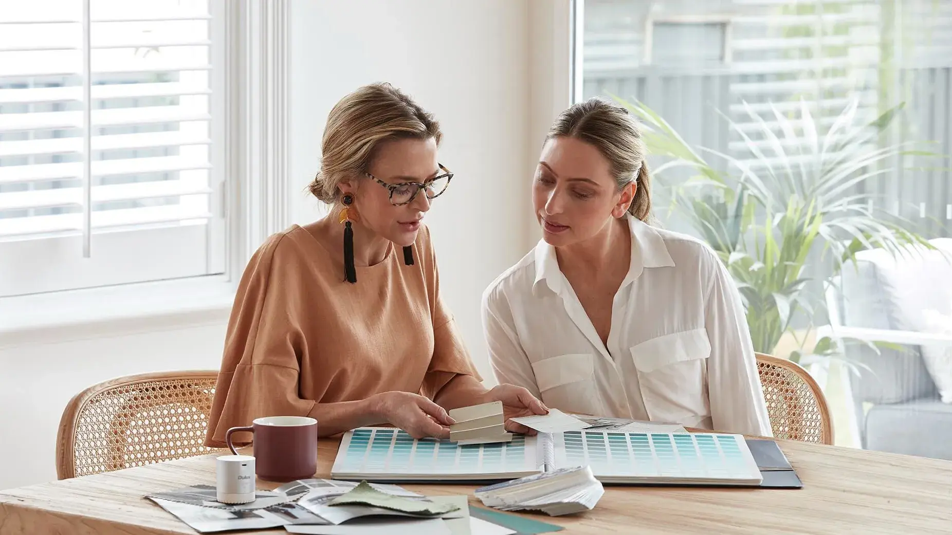 Women discussing colour samples