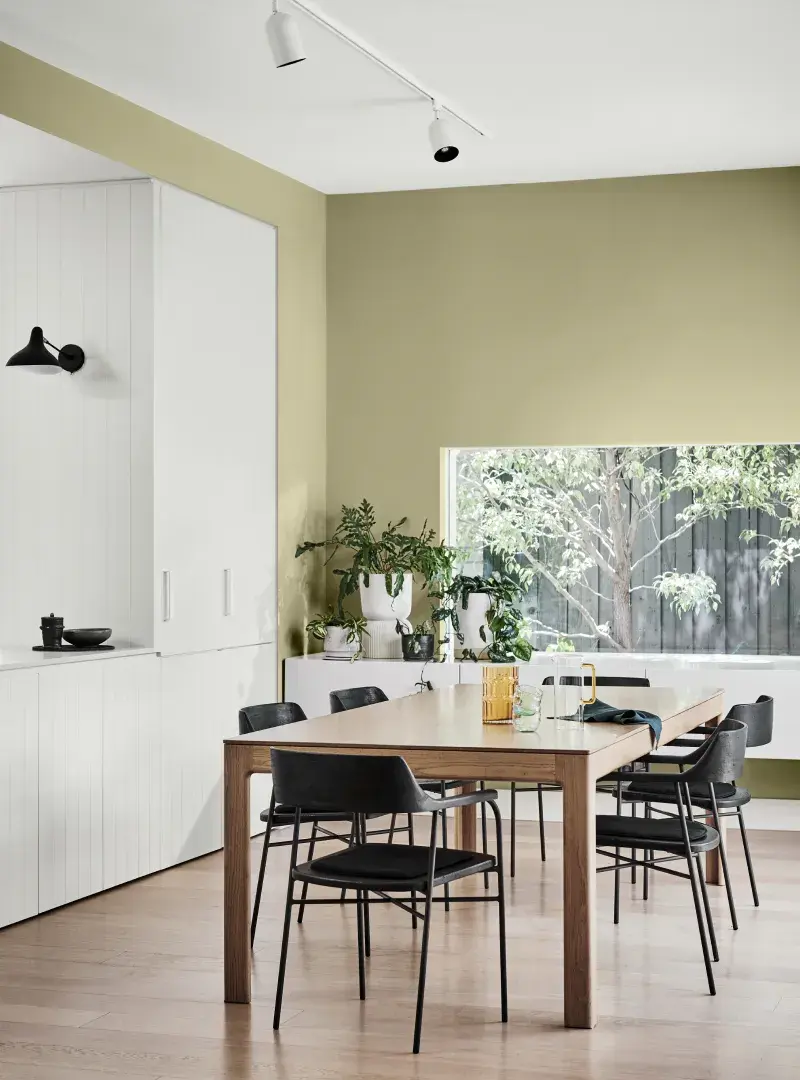 Green and light wood dining setting.