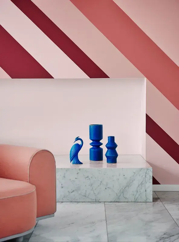 Pink interior living room with striped feature wall