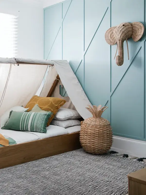 Blue and white bedroom with tent bed
