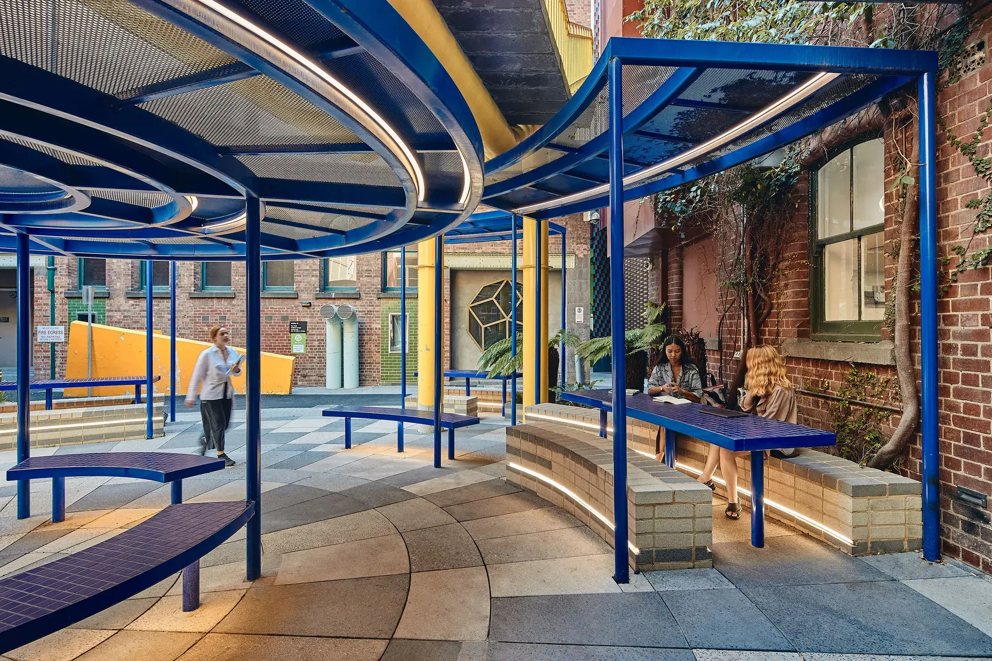 Exterior circular undercover walkway with blue poles