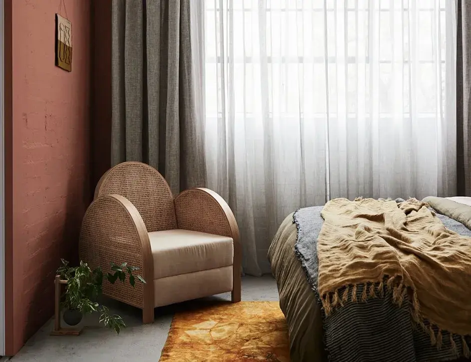 interior bedroom pink walls and chair.