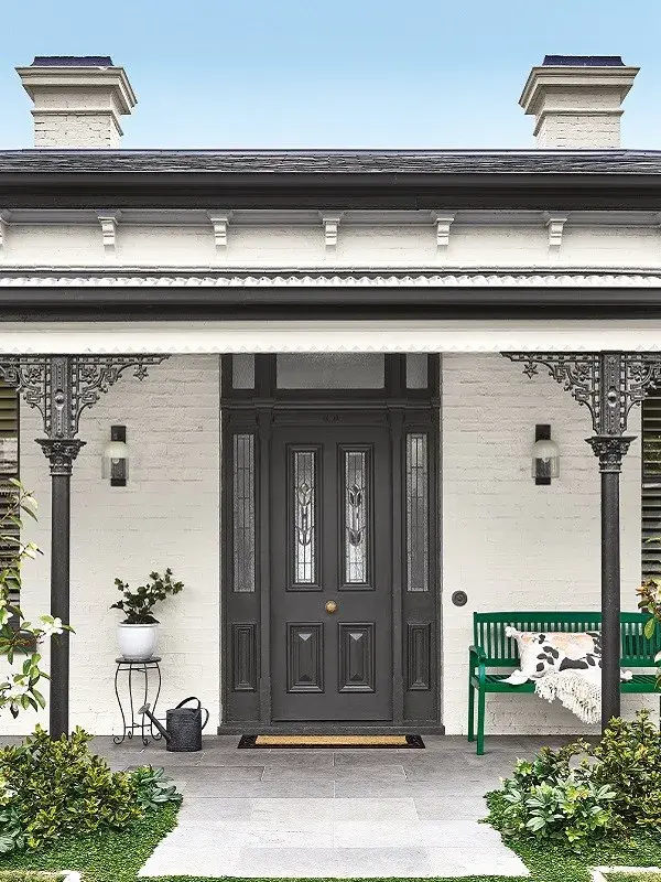 Traditional black and white house with black door and trims
